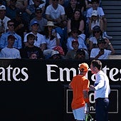 Davidovich talks to the chair umpire to complain about the behaviour of four fans shown in the picture who behaved unacceptably in the stands.