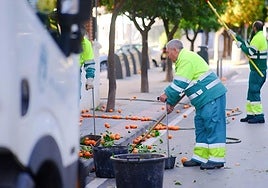 Council workers cleaning.