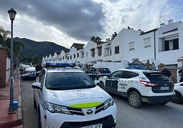 Police vehicles outside Victoria's home.