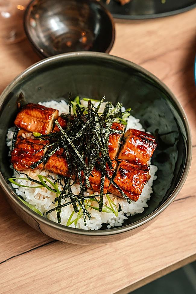 Unagi donburi, grilled eel glazed with house sauce on a bed of steamed rice.