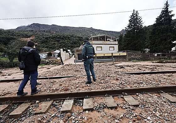 A Guardia Civil officer assessing the damage caused by storm Leonardo in the Serranía de Ronda.