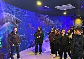 A group of local art students visit the new mural at Almuñécar's aquarium