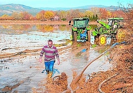 Flooded. Tractors and water pumps to drain farms.