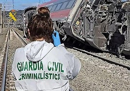 A Guardia Civil officer inspects the scene of the accident near Adamuz, Cordoba.