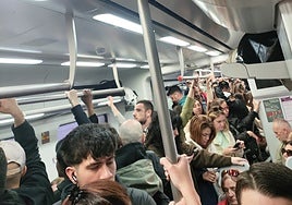 Passengers crowding a train between Malaga and Fuengirola.
