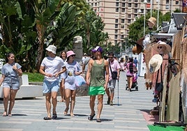 Tourists on the promenade in Almuñécar during summer 2025