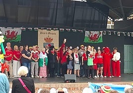 Members of the Welsh Society Costa del Sol on stage at the start the event.