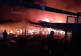 Firefighters at work at the scene.