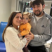 Marta Sánchez and Manuel Nieto holding their daughter Marta in Hospital Materno in Malaga.