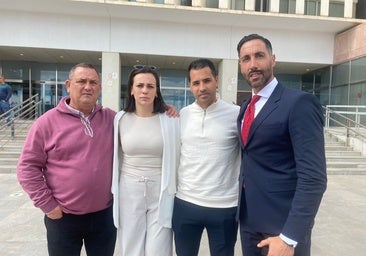 Carmen with her family and lawyer in front of the courthouse in Malaga.