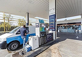 A driver filling up at a petrol station.