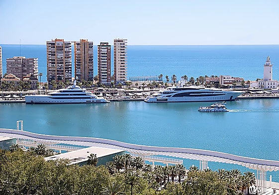 Two of the megayachts currently moored in the Malaga marina.