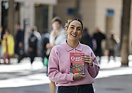 Paula Orell posing with her book.