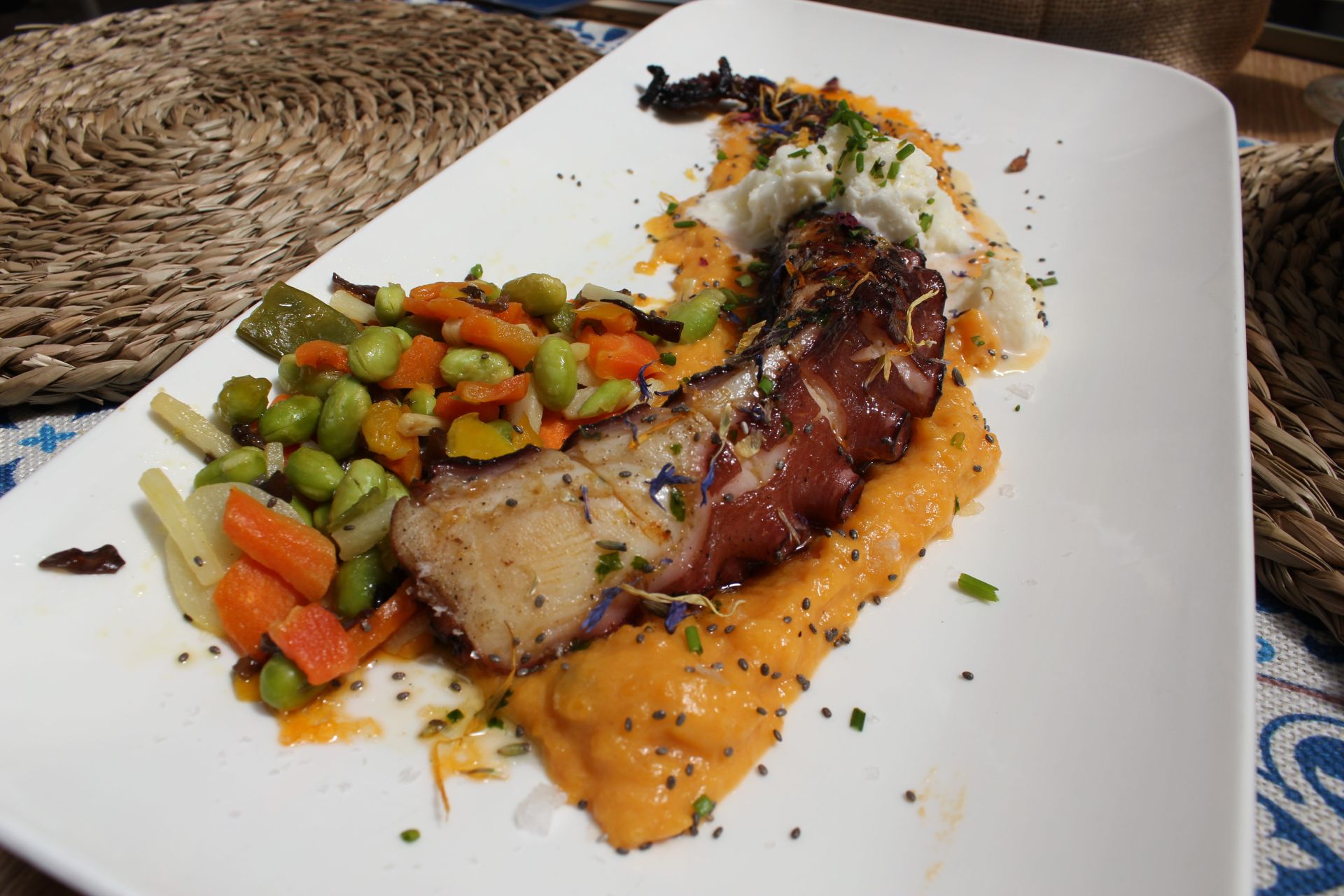 Octopus leg with sweet potato parmentier and coconut ice cream.