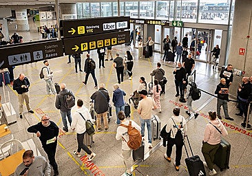 Passengers exiting Malaga Airport.
