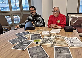 Antonio Arjona and Antonio Ruiz at SUR's headquarters in Malaga, showing materials they have gathered from their time as anti-conscription activists.