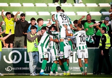 The Antequera players celebrate the winning goal with their fans.