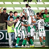 The Antequera players celebrate the winning goal with their fans.