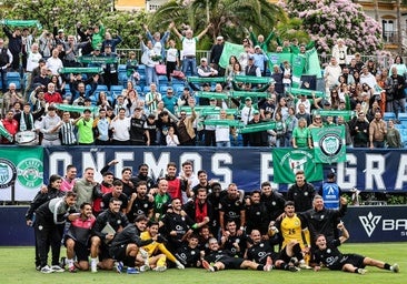 The Torremolinos squad celebrate their win with their fans inside Banús Football Center.