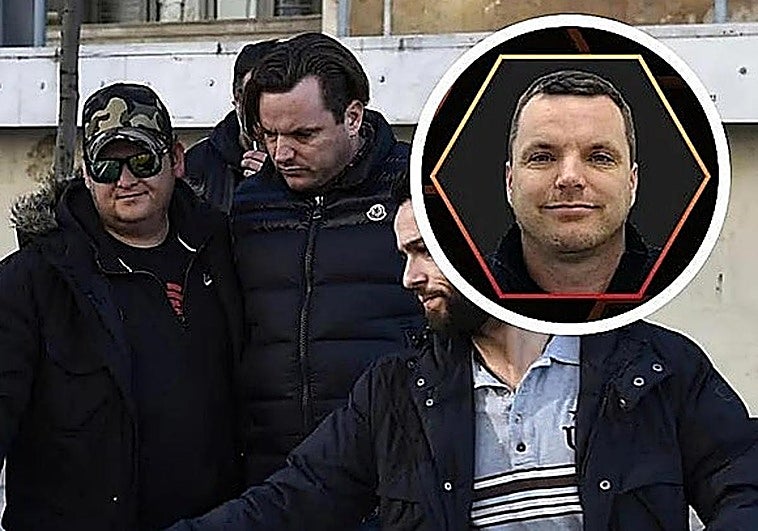 Simon Dutton, centre, being escorted by police in Greece in 2016