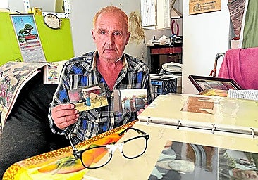 Belichko holds the remaining photographs of the performances in his hands.