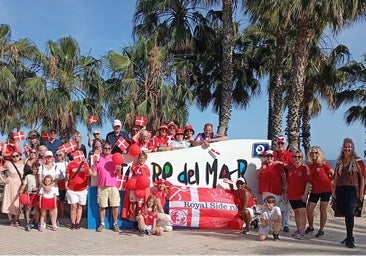 The Royal Side Run participants by the Torre del Mar sign