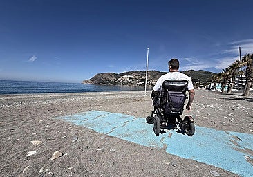 Ernesto Barbero next to the footbridge that ends a few metres from the shore of the beach in La Herradura.