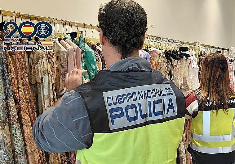The National Police looking through the counterfeit clothes in Marbella.