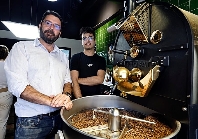 Father and son, next to the artisan coffee roastery.