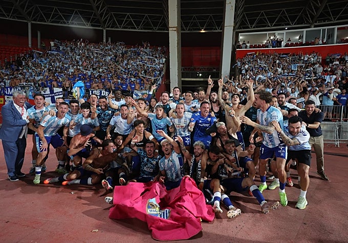 Malaga, surrounded by their supporters, celebrate their promotion in Almeria.