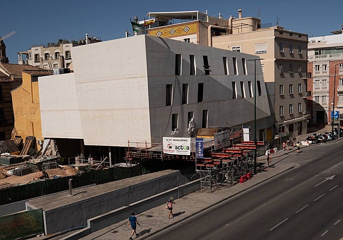 The main façade features a wedge-shaped section that breaks up the vertical lines.