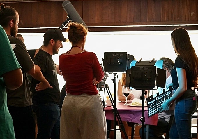 Director Javier Ruiz, wearing a cap, during the filming of 'Perros y diablos'.