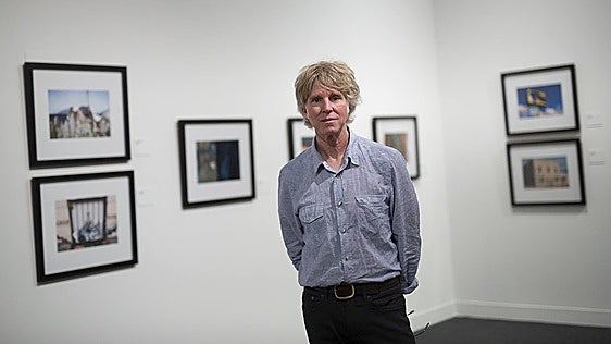 Patrick Sansone, alongside his photographs.