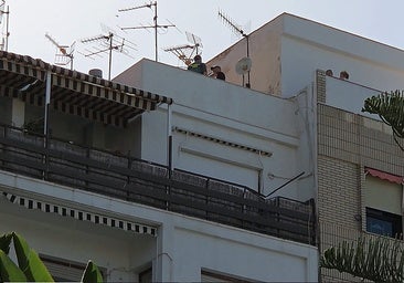 Guardia Civil officers inspecting the building from where the young man fell.