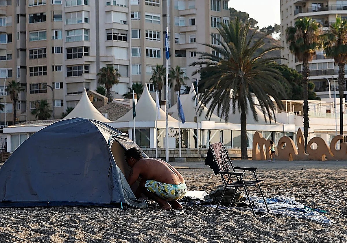 Around 20 homeless people live in tents and makeshift shelters on Malaga's La Malagueta beach