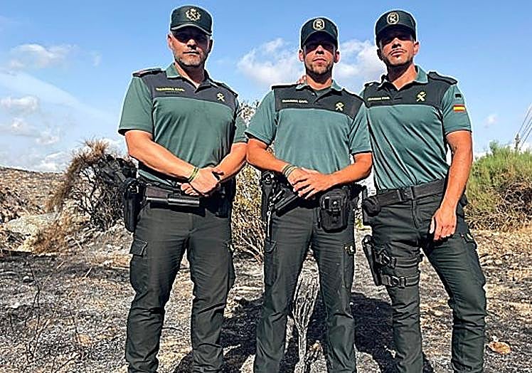 Sergeant Pedro Garre (left) and officers Rafael Zea (centre) and Manuel Moyano (right) at the scene.
