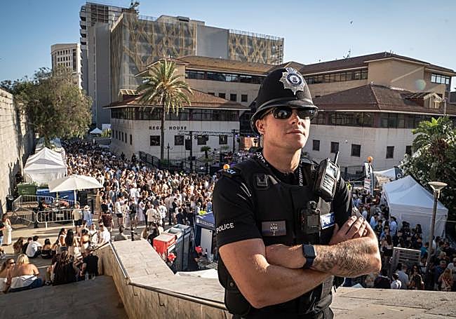 A bobby is on patrol along Main Street, the nerve centre of the British colony.