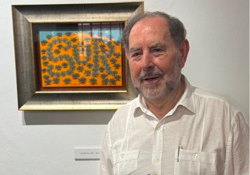 Evaristo Guerra with one of his paintings