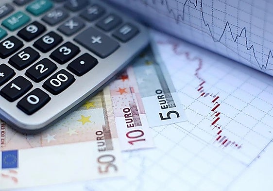 Euro notes next to a calculator.