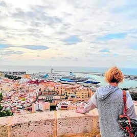 British tourists admire the city of Almería from the Alcazaba.