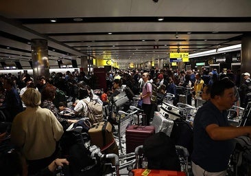 Crowds of passengers at Heathrow Airport following mass flight cancellations.