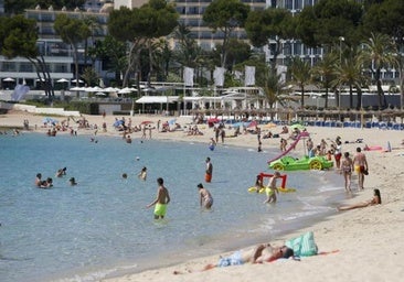 File photo of tourists on the beach in Magaluf.