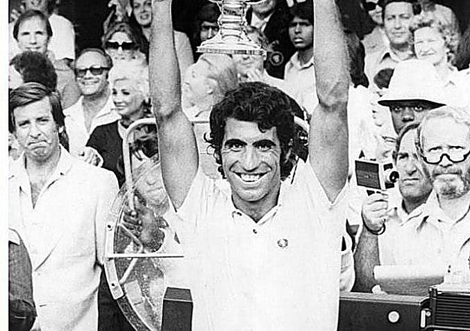 Raising his trophy in 1975.