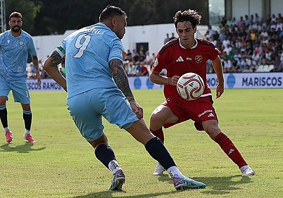 Torremolinos forward Dioni on the ball.