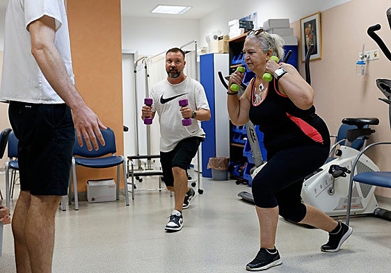 Two of the patients are doing strength training exercises in the Cardiac Rehabilitation Unit.