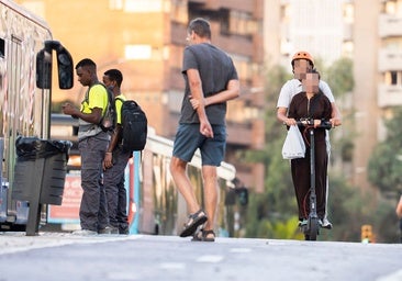 Two people are riding a scooter.