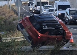 Photo of the overturned car in Malaga.