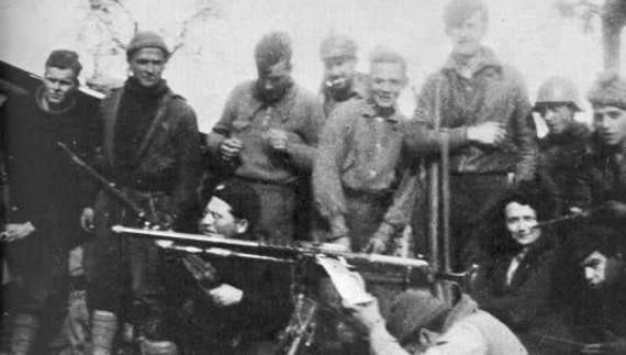 Orwell (the tall one towards the right) with POUM fighters at the front near Huesca in 1937.
