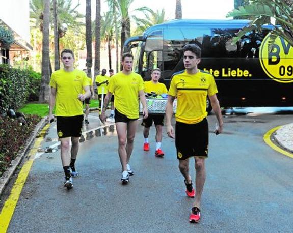 Borussia Dortmund players, led by Spain international Marc Bartra, at the entrance to the Gran Meliá Don Pepe hotel