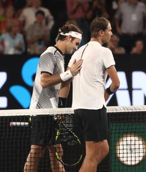 Roger Federer (left) walks next to Rafael Nadal (right) after the Swiss' Australian Open victory on Sunday